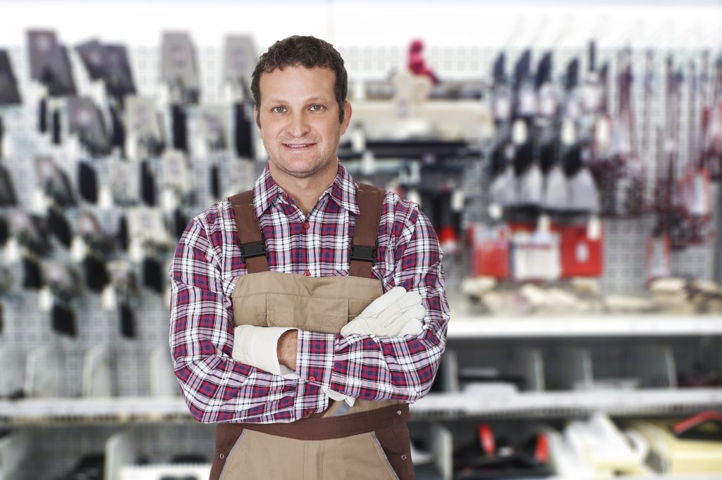 Portrait Of A Confident Male Worker With Arm Crossed
