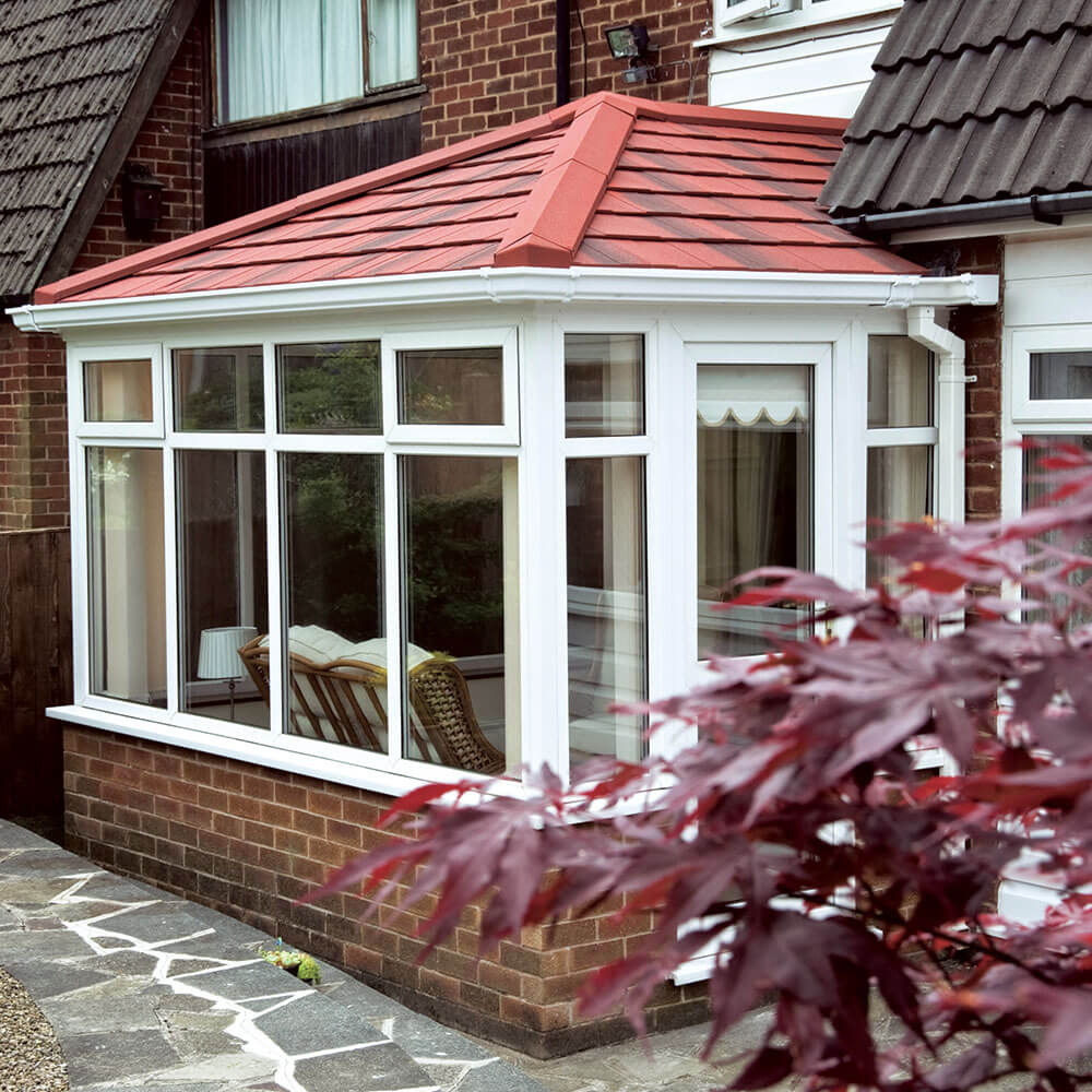 conservatory with red guardian warm tiled roof