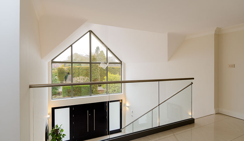 interior view of landing in home upstairs looking out to a window