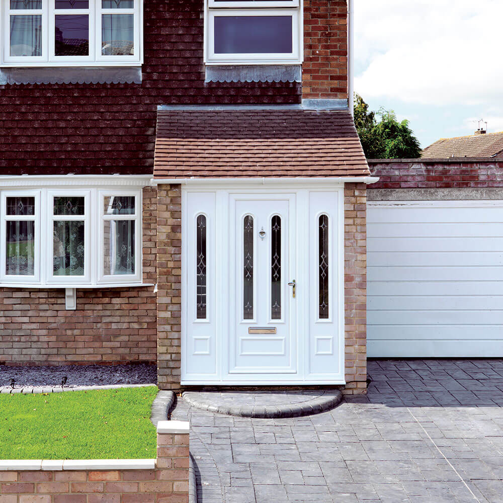 exterior shot of upvc front door and drive way leading to home