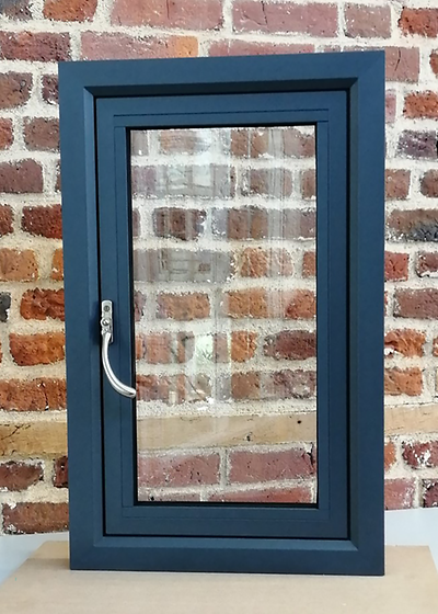 anthracite grey upvc window leant against wall